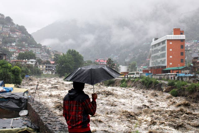 <p>A man looks at the swollen Beas River following heavy rains in Kullu, Himachal Pradesh, India</p>