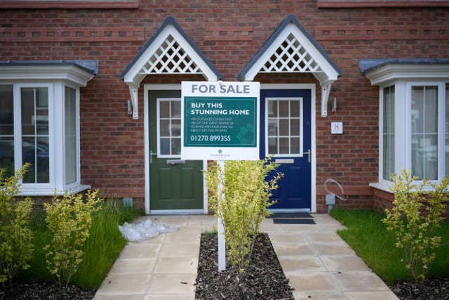 <p>A for sale sign is seen outside new houses on a construction development on 22 June 2023 in Nantwich, England</p>
