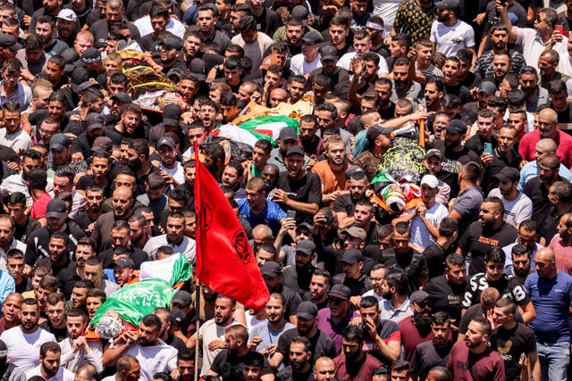 <p>Mourners carry the bodies of Palestinians killed in clashes in the Israeli military operation during the funeral in Jenin in the occupied West Bank</p>