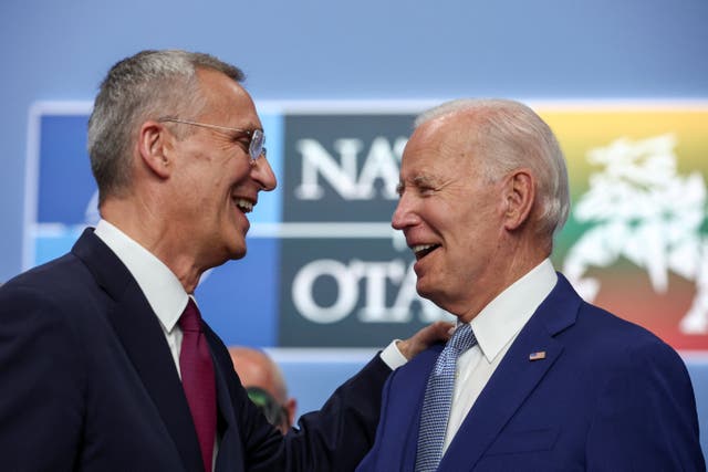 <p>Jens Stoltenberg (left) speaks with Joe Biden at the Nato summit in Vilnius </p>