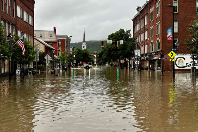 <p>A vehicle makes its way through a flooded street, in Montpelier, Vermont, U.S., July 11, 2023</p>
