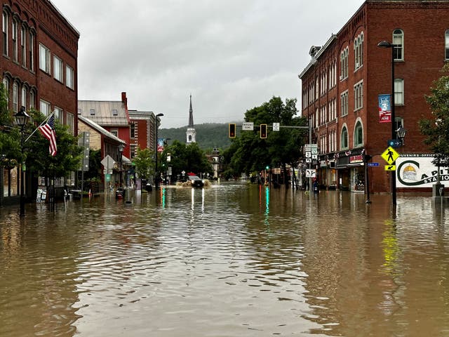 <p>A vehicle makes its way through a flooded street, in Montpelier, Vermont, U.S., July 11, 2023</p>