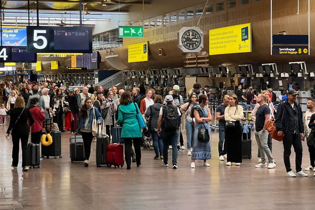 <p>Departing soon? Passengers at Stockholm Arlanda airport – and yes, that long line of people is the queue for security </p>