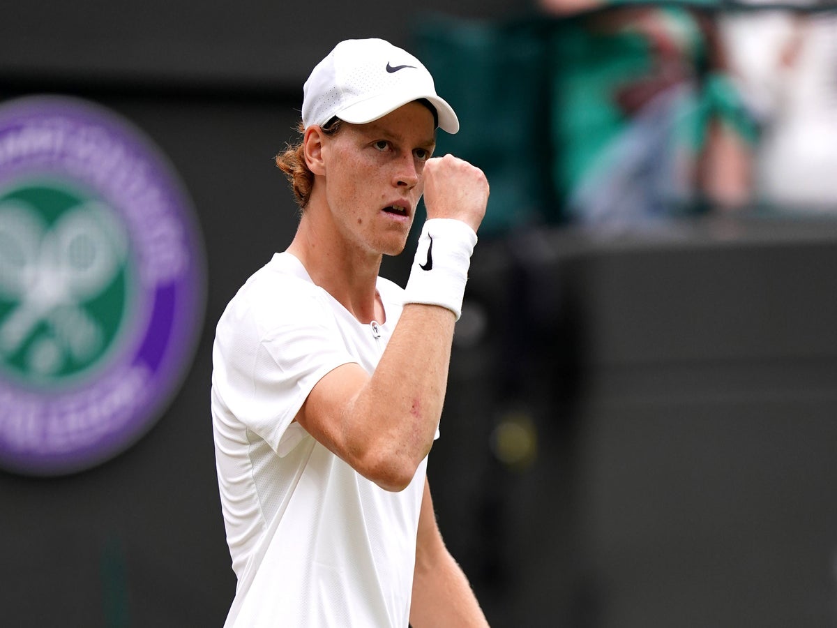 Jannik Sinner of Italy plays a forehand in his quarter final match