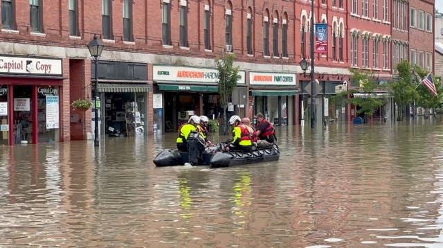 <p>Emergency services work following flooding, in Montpelier, Vermont</p>