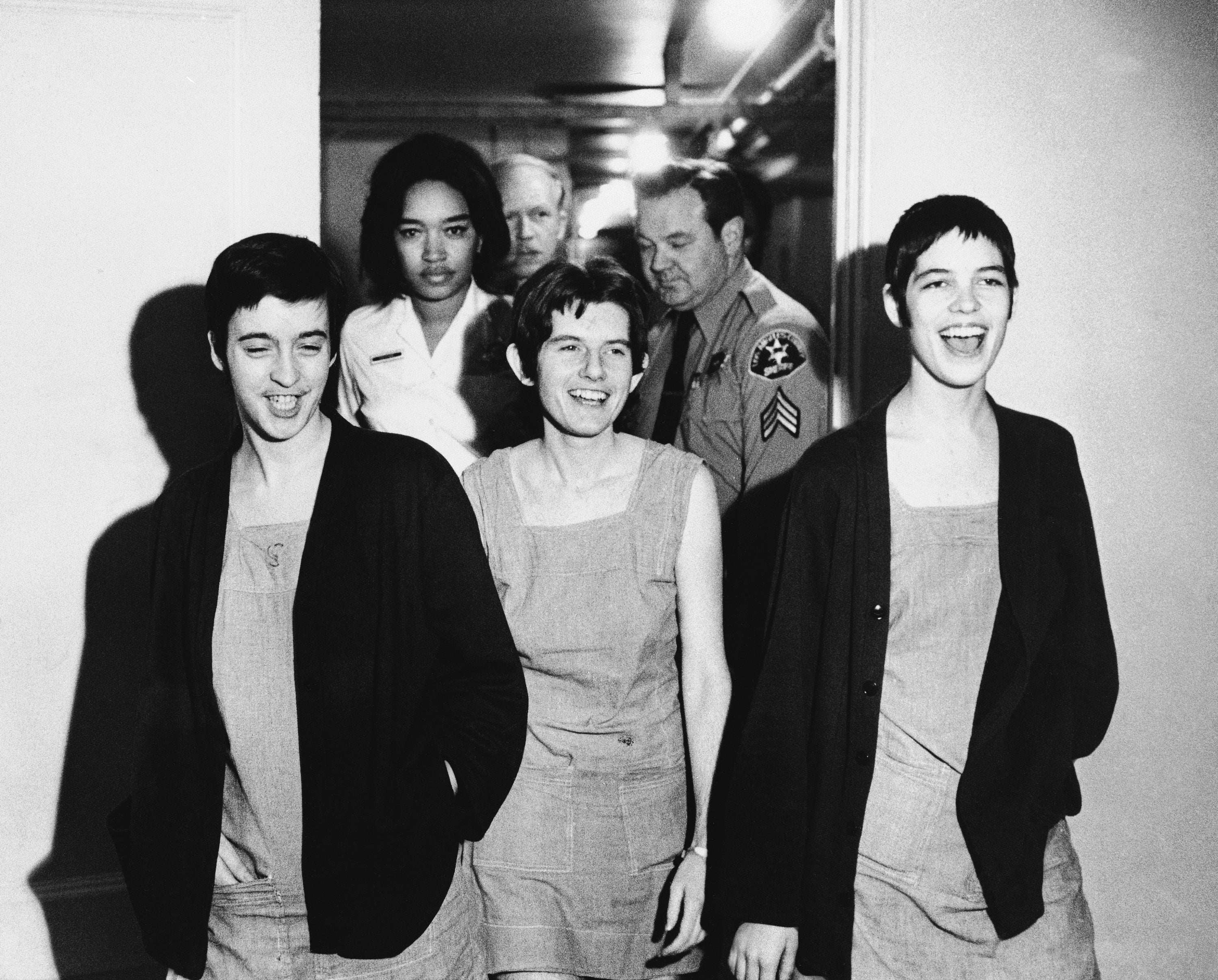 Three women co-defendants in the Sharon Tate murder case, from left, Susan Atkins, Patricia Krenwinkel and Leslie Van Houten, laugh as they walk to court in Los Angeles for sentencing on March 29, 1971. Van Houten, one of Charles Manson's followers, was released from prison on parole on Tuesday, 11 July 2023