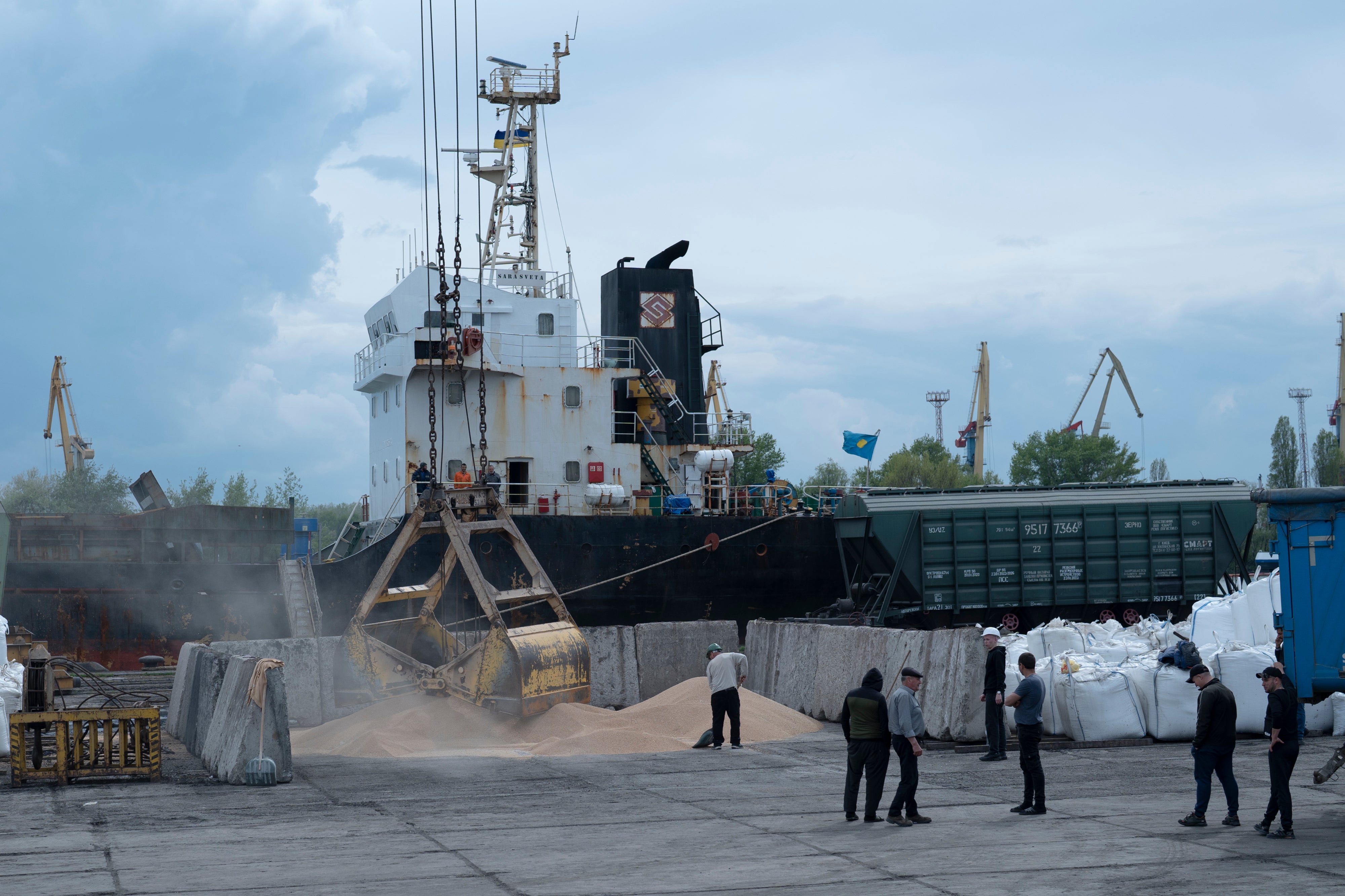 Workers load grain at a grain port in Izmail, Ukraine earlier this year