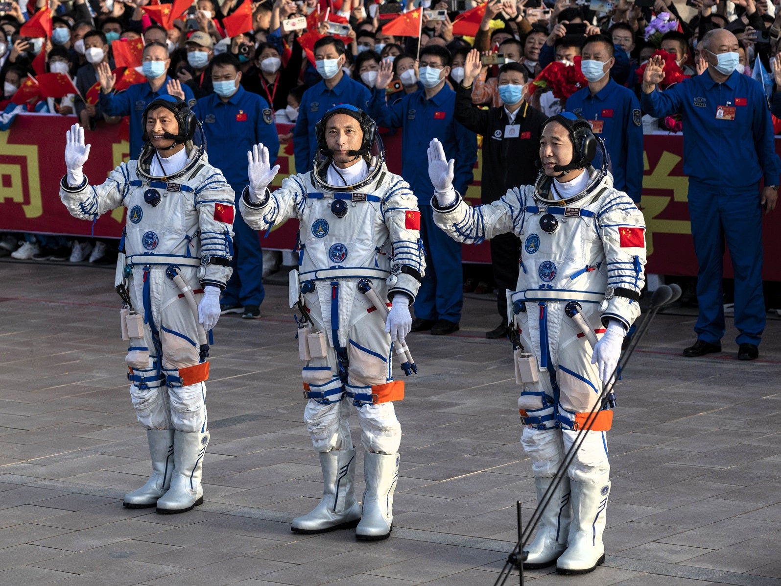 Chinese astronauts and crew of the Shenzhou-16 mission at China’s Manned Space Agency wave to well wishers at a pre-launch departure ceremony on 30 May, 2023 in Jiuquan, China