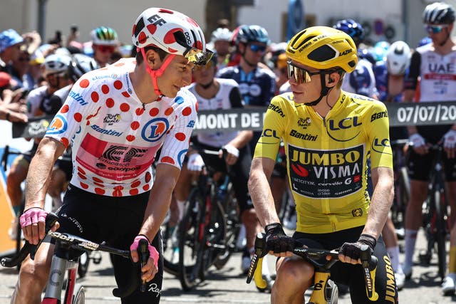 <p>Neilson Powless and Jonas Vingegaard share words before the start of the stage</p>