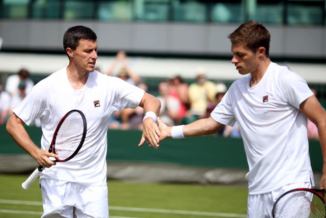 Neal Skupski, right, has revealed his brother and coach Ken, left, has a holiday conundrum (Steven Paston/PA)