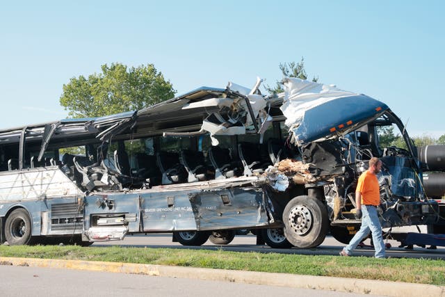 <p>A worker helps clear the wreckage of a Greyhound bus that collided with tractor-trailers on the exit ramp to a rest area on westbound Interstate 70 in Highland, Ill., on Wednesday, July 12, 2023.</p>