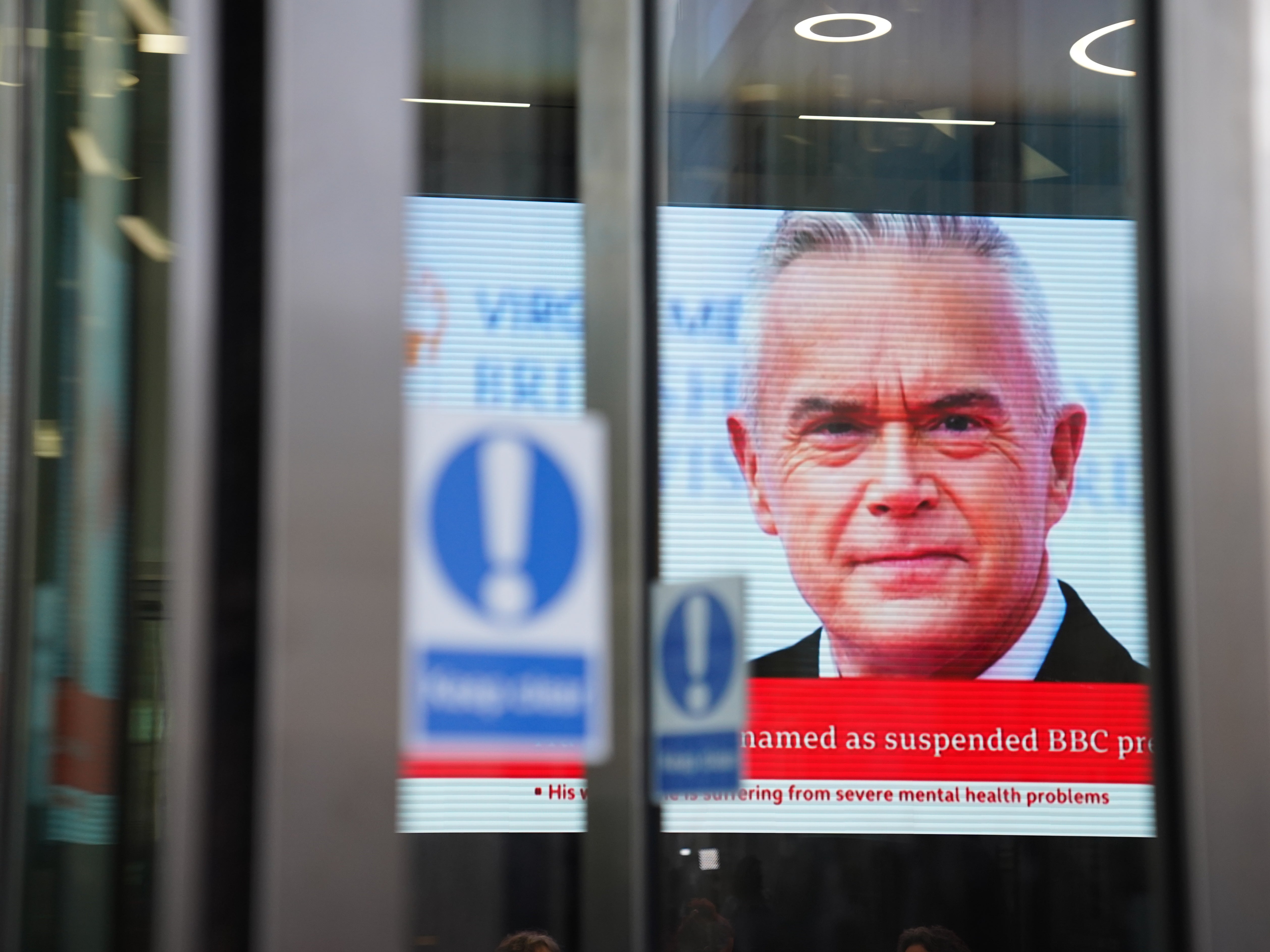A screen in BBC Broadcasting House as Huw Edwards is revealed as the presenter at the centre of the storm