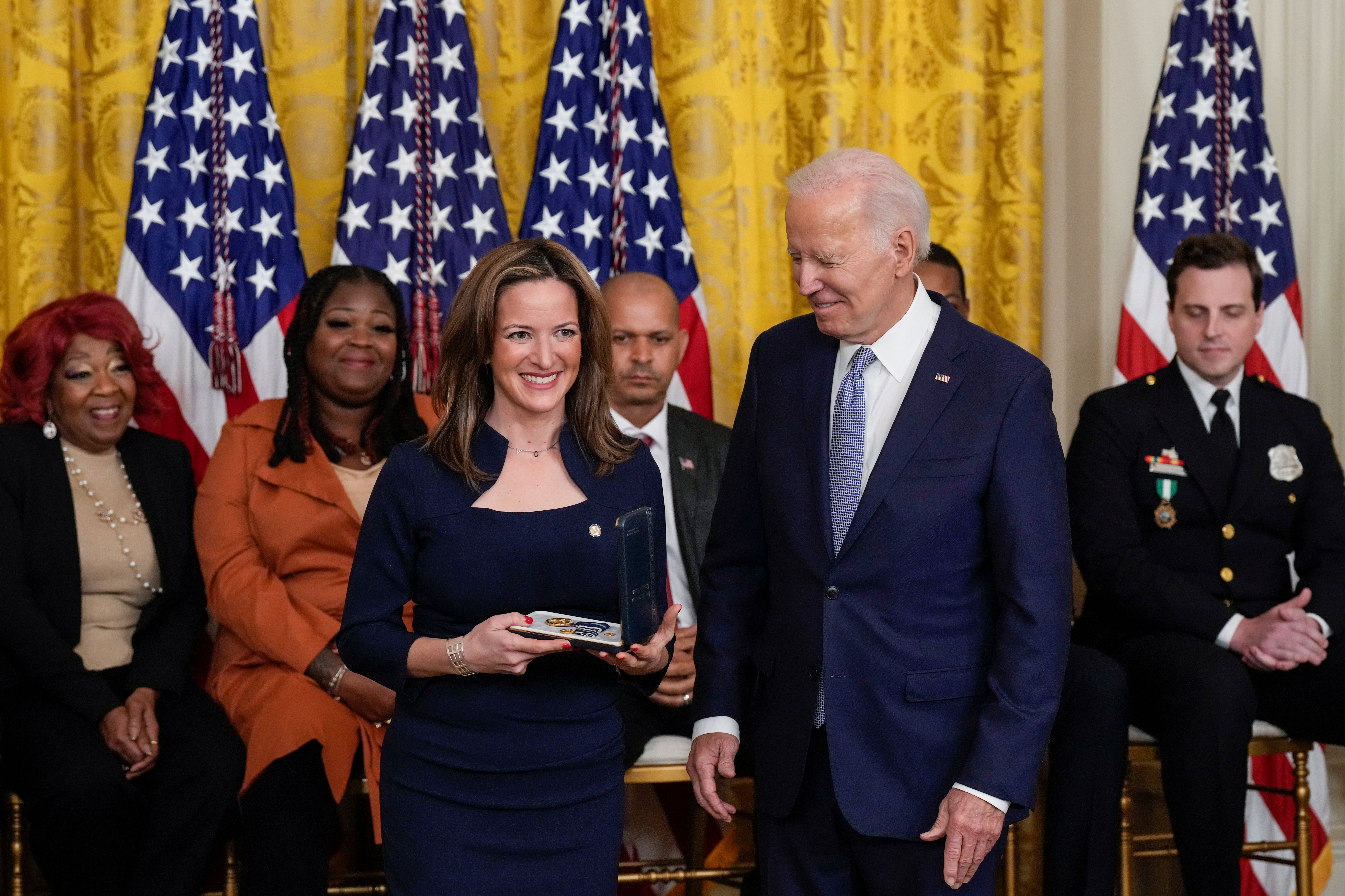 President Joe Biden presents Michigan Secretary of State Jocelyn Benson a Presidential Citizens Medal during a ceremony to mark the two-year anniversary of the January 6 attack on the Capitol