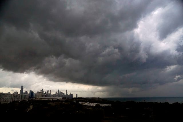 <p>Storm clouds pass over downtown Chicago and the Bronzeville neighborhood of the city heading East out over Lake Michigan as the National Weather Service continued to issue multiple tornado warnings in the greater metropolitan area Wednesday, July 12, 2023</p>