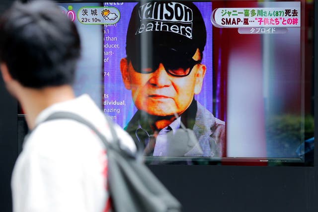 <p>File photo: A passerby watches a TV news reporting Johnny Kitagawa’s passing away in Tokyo, on 10 July 2019</p>