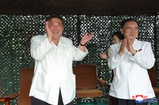 North Korea threatens US after record ICBM launch as pictures of delighted Kim Jong-un emerge
