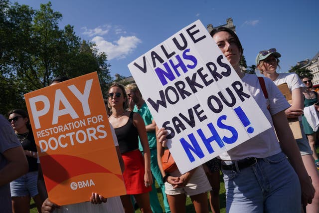 Striking junior doctors from the British Medical Association take part in a rally in Parliament Square, Westminster, in June (PA)