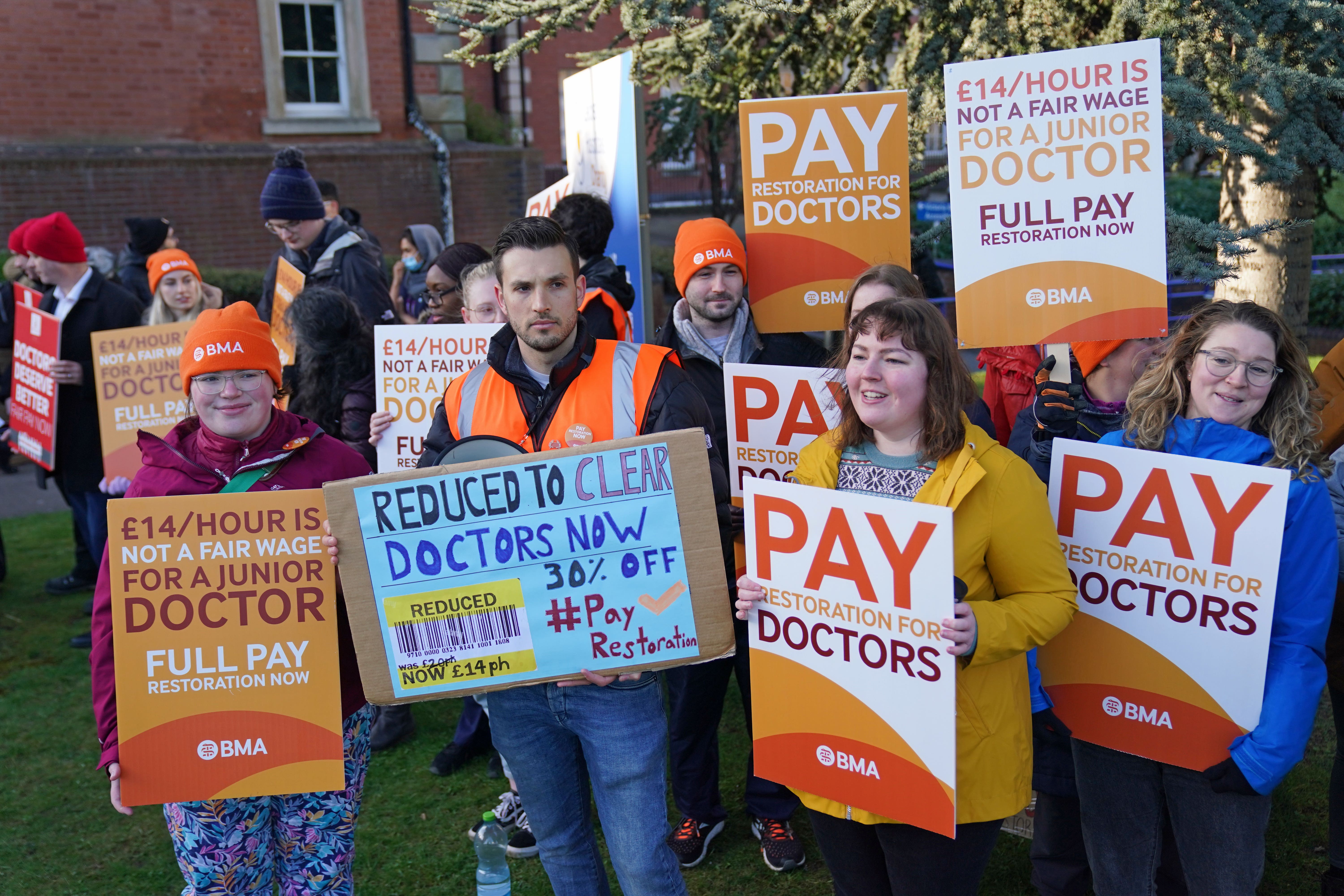 Striking NHS junior doctors on the picket line outside Leicester Royal Infirmary in April (PA)