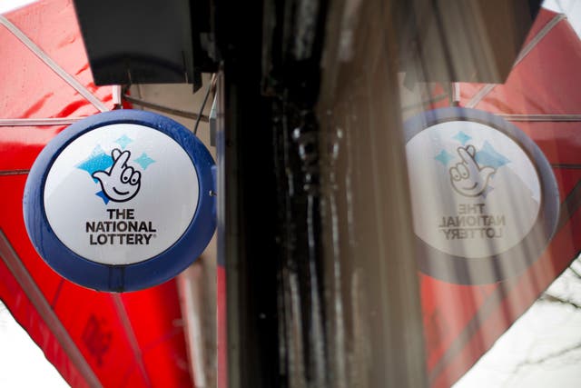 The two winners will split a jackpot of £62 million (Yui Mok/PA)