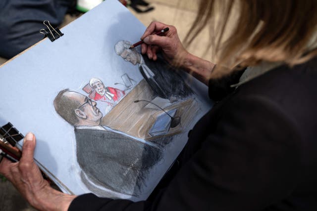 Court sketch artist Elizabeth Cook puts the finishing touches on her drawing of actor Kevin Spacey giving evidence at Southwark Crown Court (Aaron Chown/PA)
