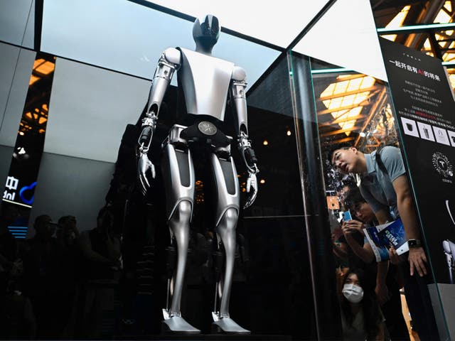 <p>Tesla’s robot displayed at the 2023 World Artificial Intelligence Conference. Elon Musk has previously said that AI is ‘potentially more dangerous than nukes’  </p>