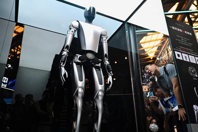 <p>Tesla’s robot displayed at the 2023 World Artificial Intelligence Conference. Elon Musk has previously said that AI is ‘potentially more dangerous than nukes’  </p>