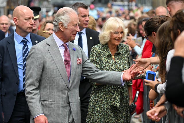 The King and Queen during a visit to St Ives Harbour, Cornwall (Finnbarr Webster/PA)