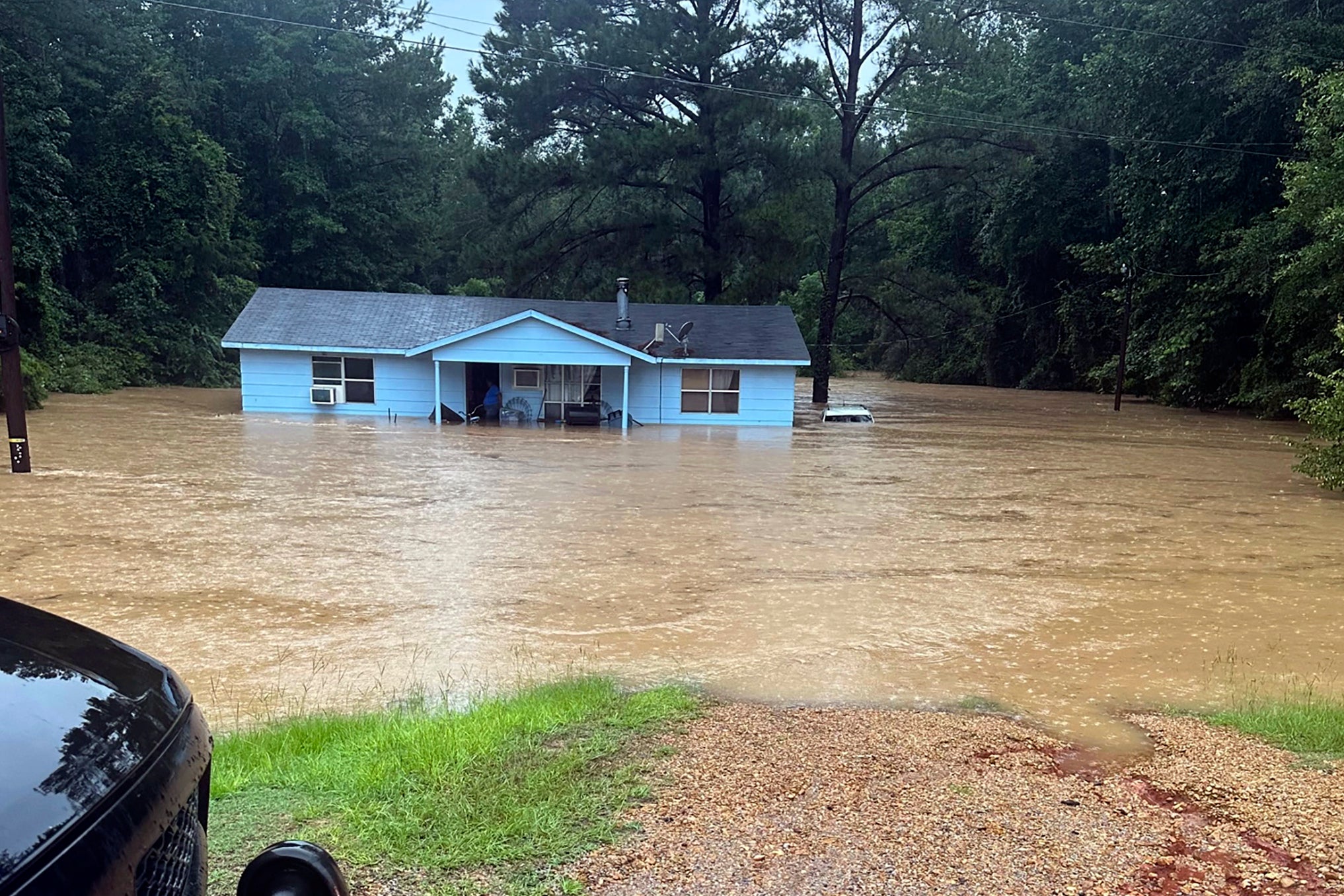 People rescued from cars and homes as rapid rainfall causes flash