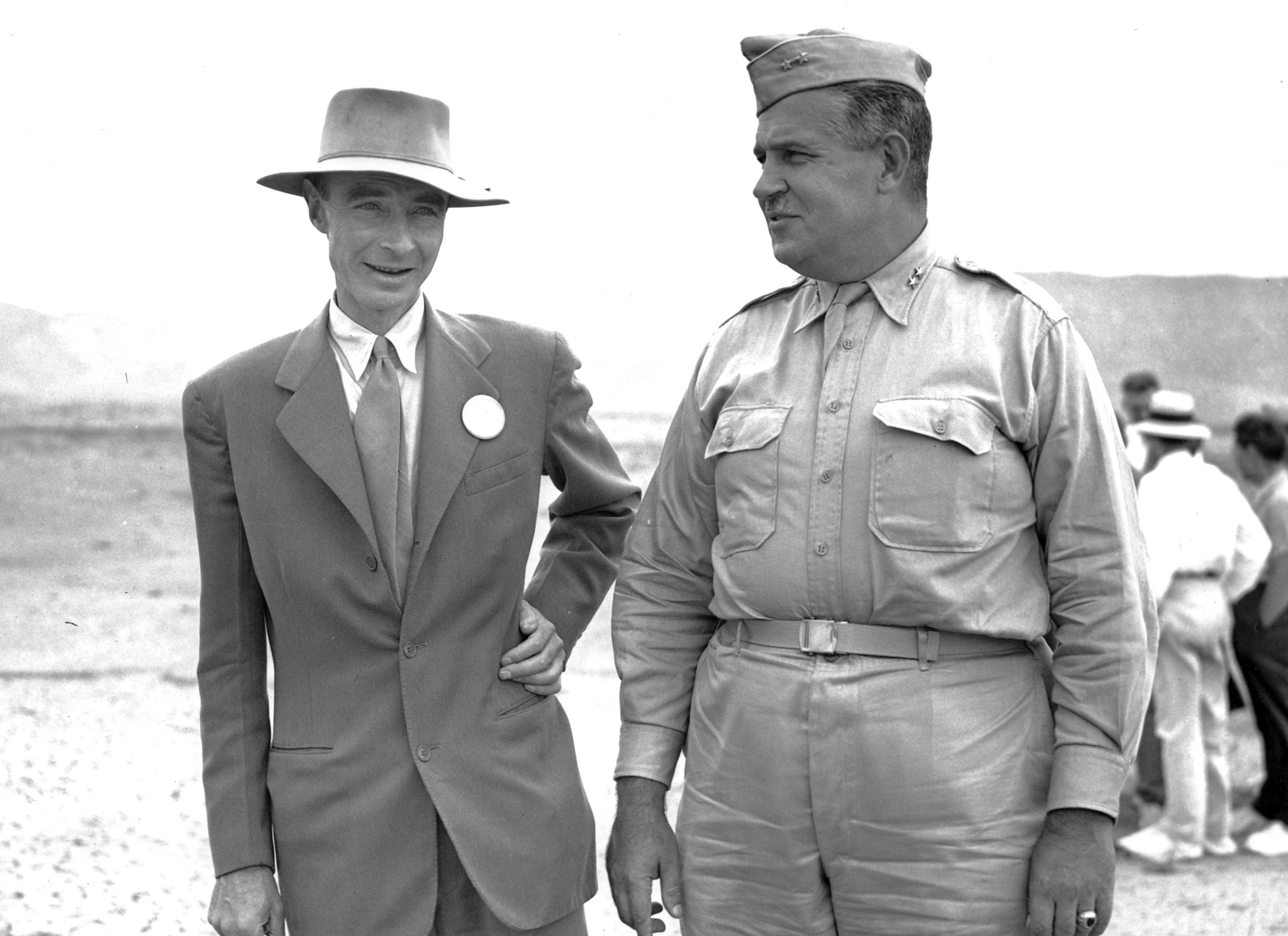 Gen John Leslie R Groves, right, appears with Dr J Robert Oppenheimer, at the New Mexico bomb test site in September 1945