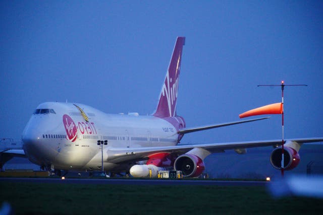 A repurposed Virgin Atlantic Boeing 747 aircraft carrying Virgin Orbit’s LauncherOne rocket (Ben Birchall/PA)