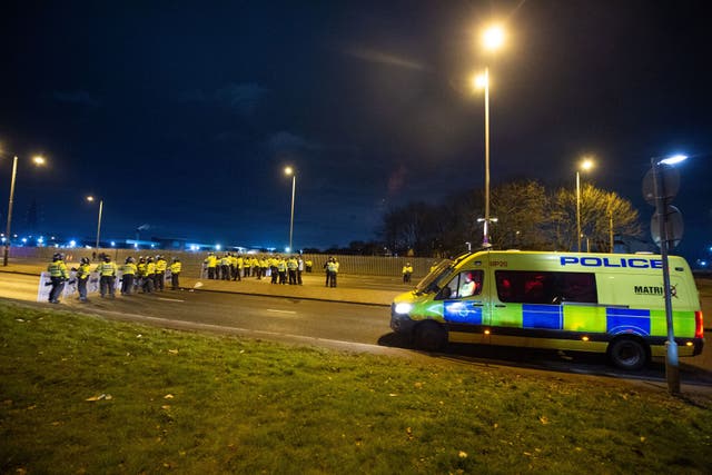 File photo of police in riot gear after a demonstration outside the Suites Hotel in Knowsley, Merseyside (Peter Powell/PA)