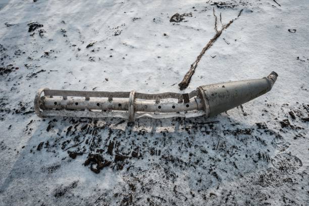 A casing of a cluster bomb rocket lays on the ground in Zarichne, Ukraine