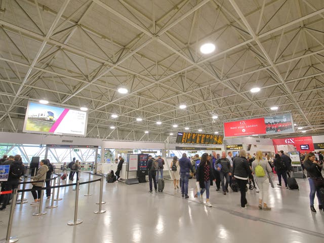 <p>Holiday mood: Passengers at Gatwick airport’s South Terminal</p>