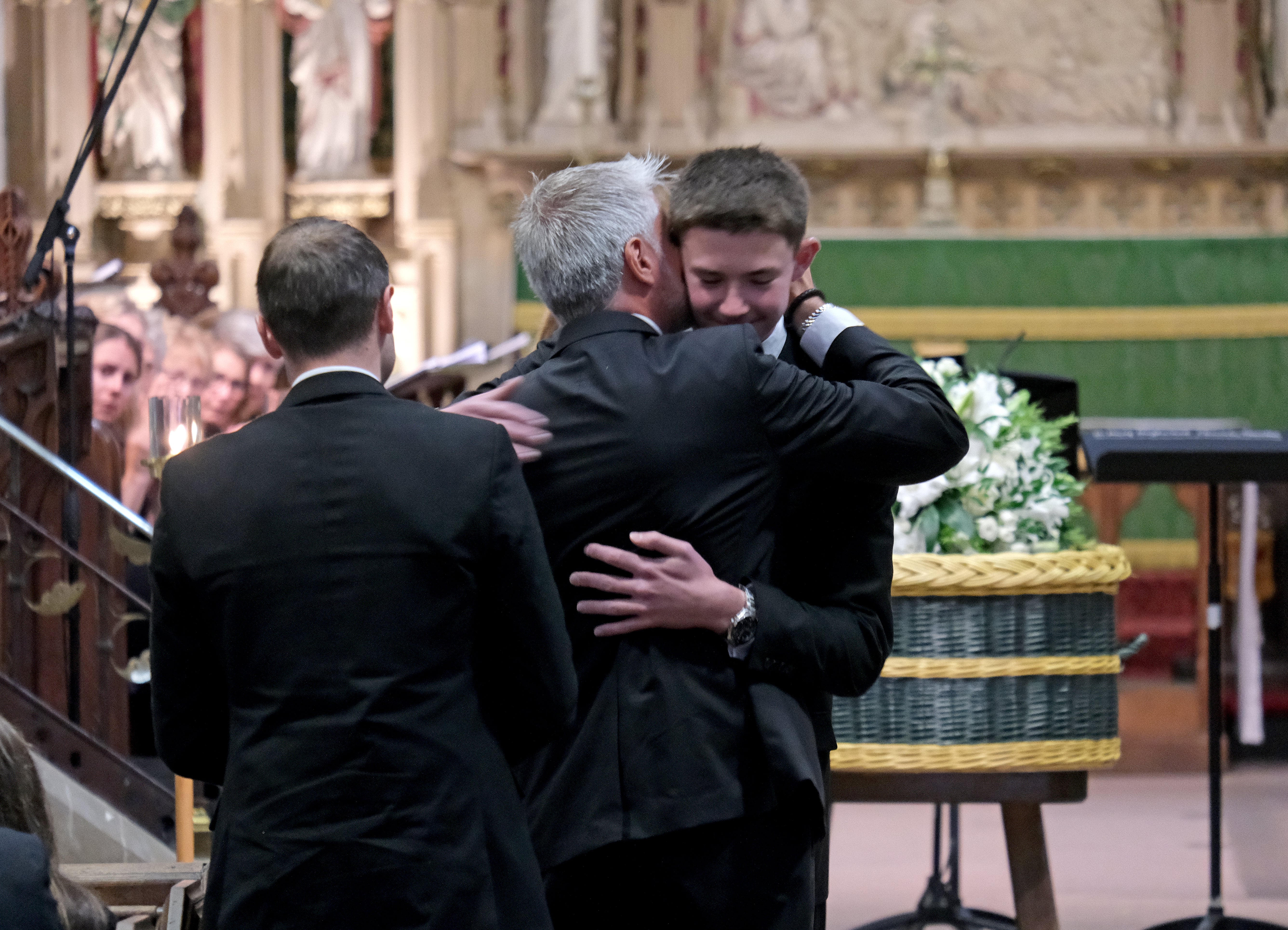 His brother was embraced by his father David after his touching tribute