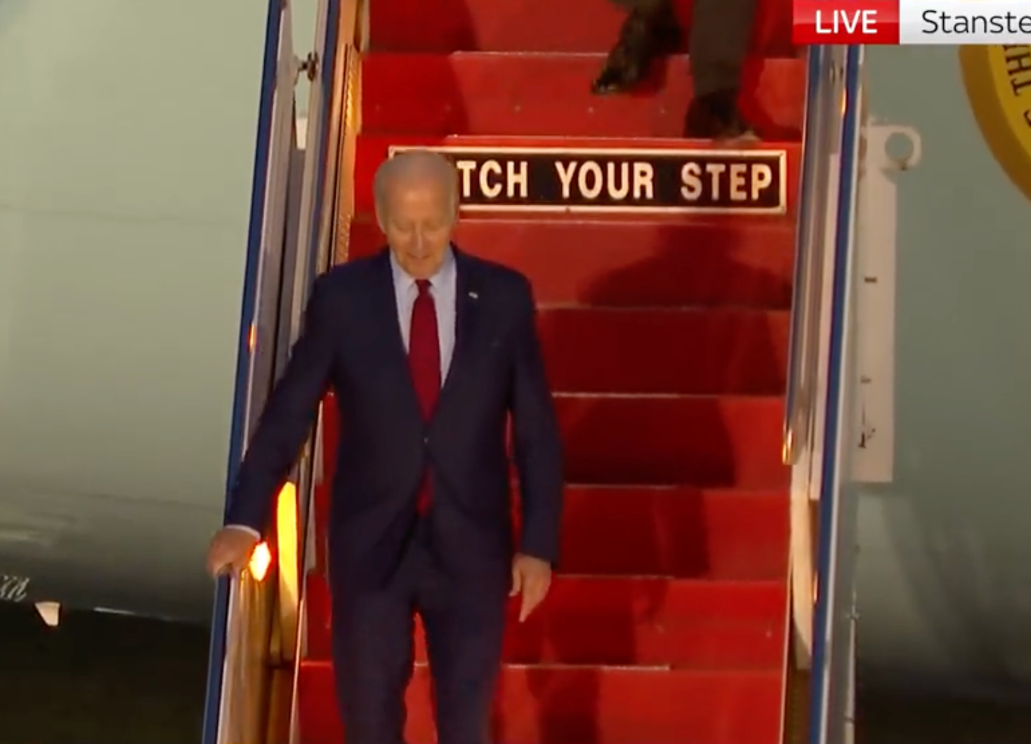 A ‘watch your step’ sign was spotted on Air Force One as Joe Biden arrived in the UK earlier this week.