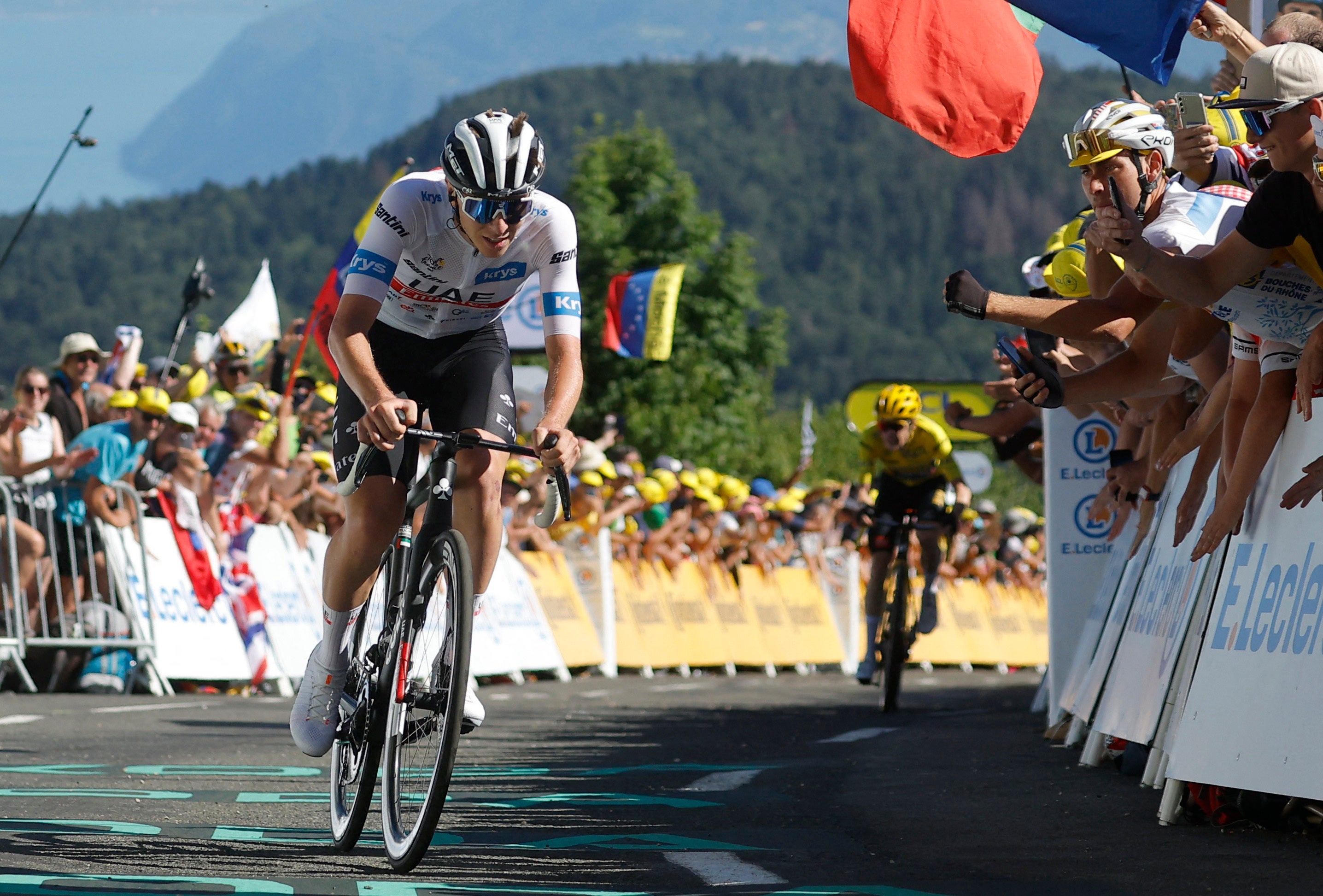 Tadej Pogacar rides away from Jonas Vingegaard at the finish