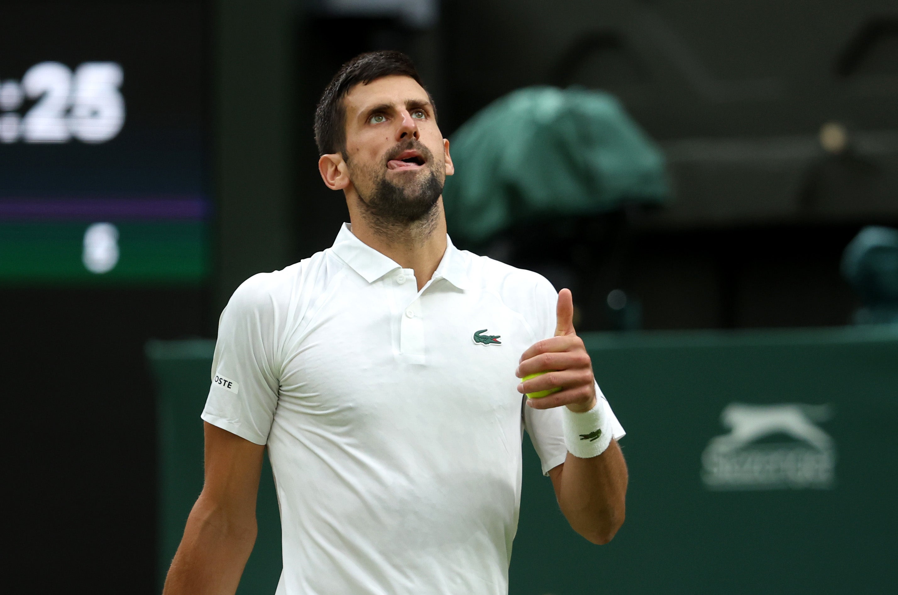 Djokovic reacts after noise from the crowd in between serves