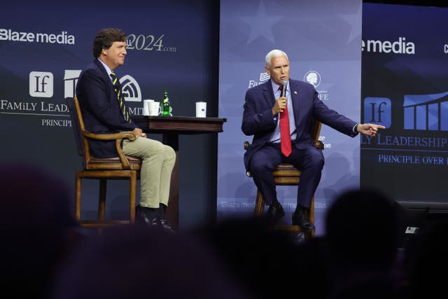 <p>Mike Pence fields questions from former Fox News host Tucker Carlson at the at the Family Leadership Summit in Des Moines, Iowa</p>