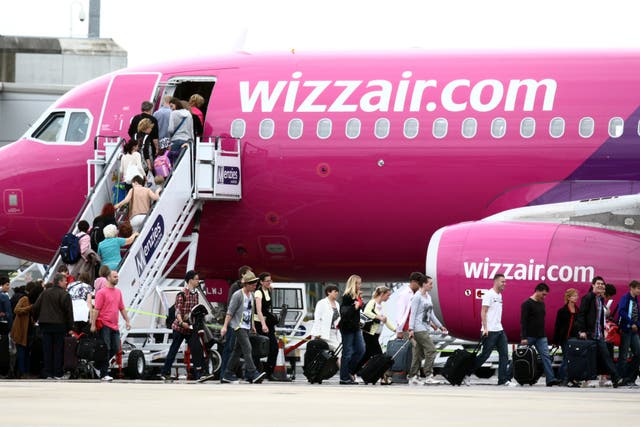 Passengers getting on a Wizz Air plane at Luton Airport (Steve Parsons/PA)