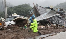 Over 20 dead and 10 missing as landslides, flood sweep homes in South Korea