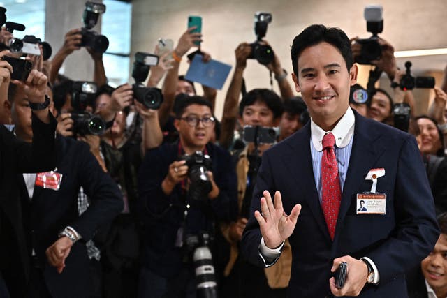 <p>Move Forward Party Leader and prime minister candidate Pita Limjaroenrat gestures as he arrives at the Thai Parliament</p>