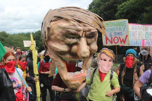 Activists held a protest march carrying a caricature of Ineos boss Sir Jim Ratcliffe (Climate Camp Scotland/PA)