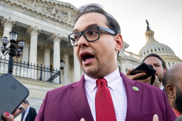 <p>Mr Santos speaking outside of the Capitol after being charged with  a number of financial crimes</p>