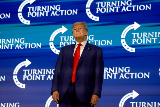 <p>Former US President Donald Trump arrives on stage to speak at the Turning Point Action conference as he continues his 2024 presidential campaign on July 15, 2023 in West Palm Beach, Florida. </p>