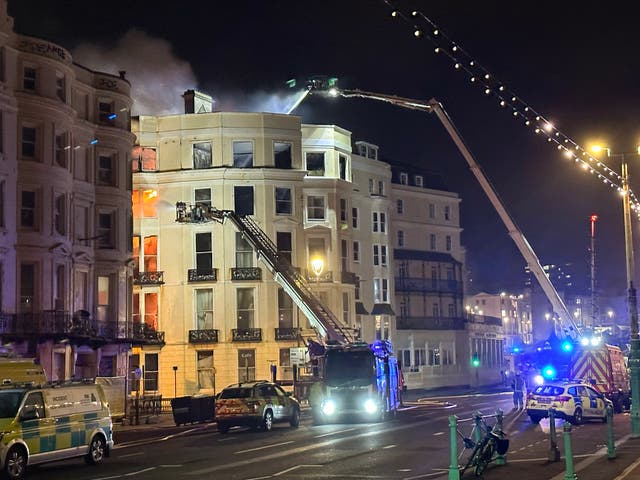 <p>Firefighters on scene at a large fire at the Royal Albion Hotel beside Brighton seafront</p>