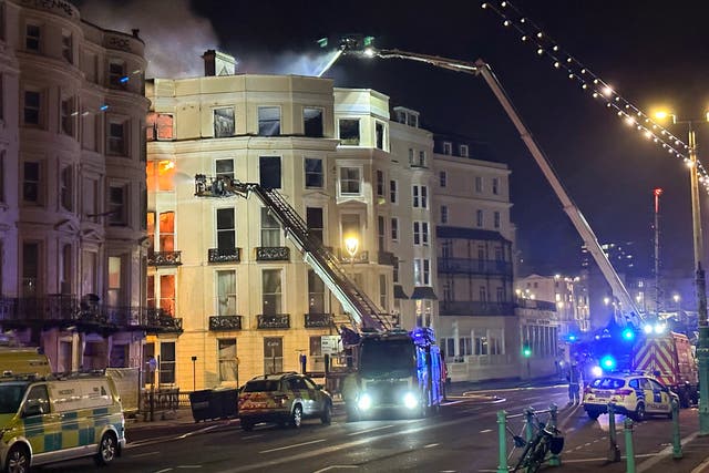 <p>Firefighters on scene at a large fire at the Royal Albion Hotel beside Brighton seafront</p>
