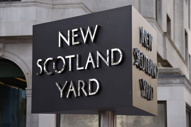 The New Scotland Yard sign outside the Metropolitan Police headquarters in London (Kirsty O’Connor/PA)