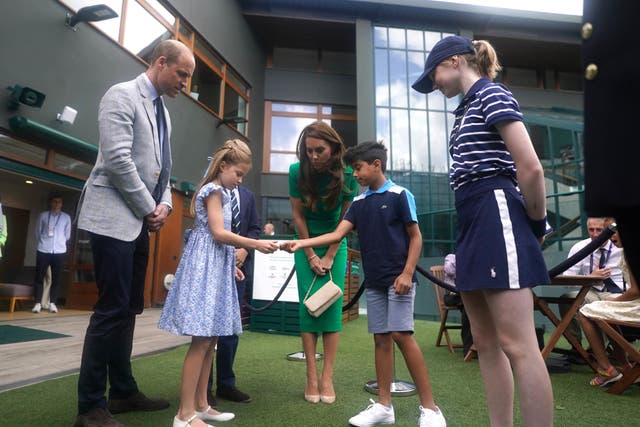 The Prince and Princess of Wales with Prince George and Princess Charlotte spoke to Mu’awwiz Anwar (Victoria Jones/PA)
