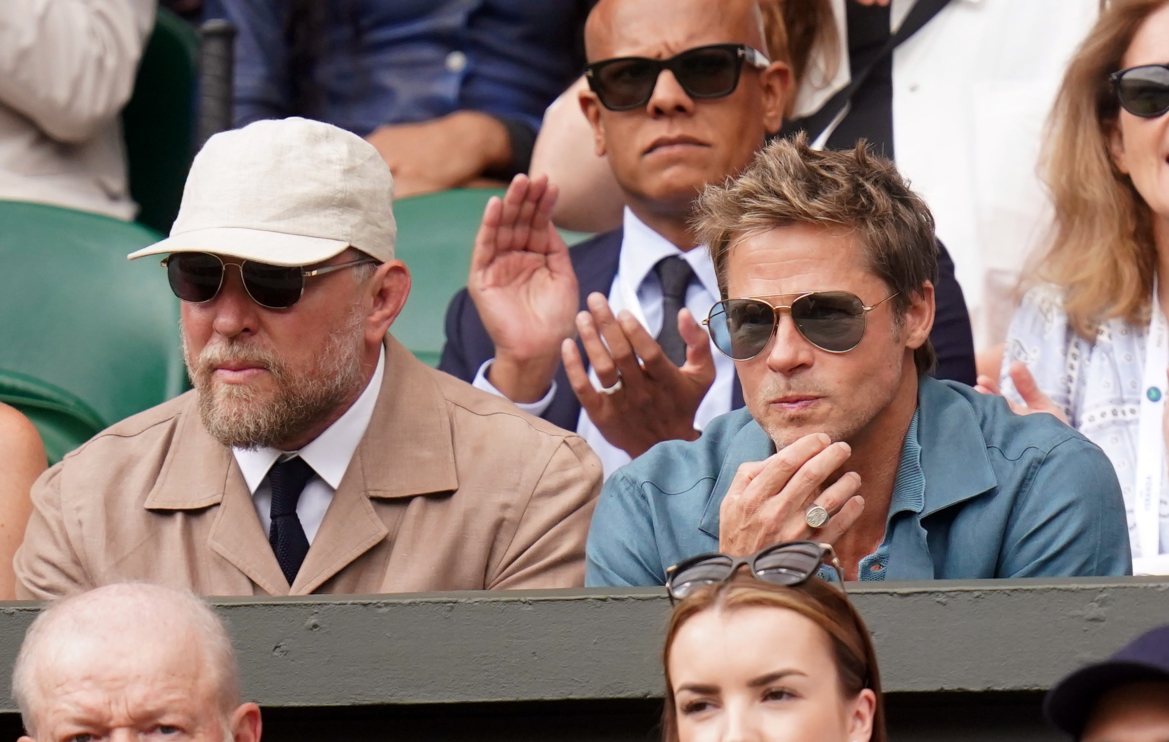 Brad Pitt (right) and Guy Ritchie (left) watching the Gentlemen's Singles final on day fourteen of the 2023 Wimbledon Championships