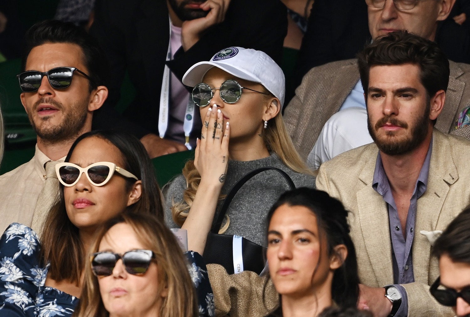 Actor Jonathan Bailey, singer Ariana Grande and actor Andrew Garfield in the stands during the men's singles final